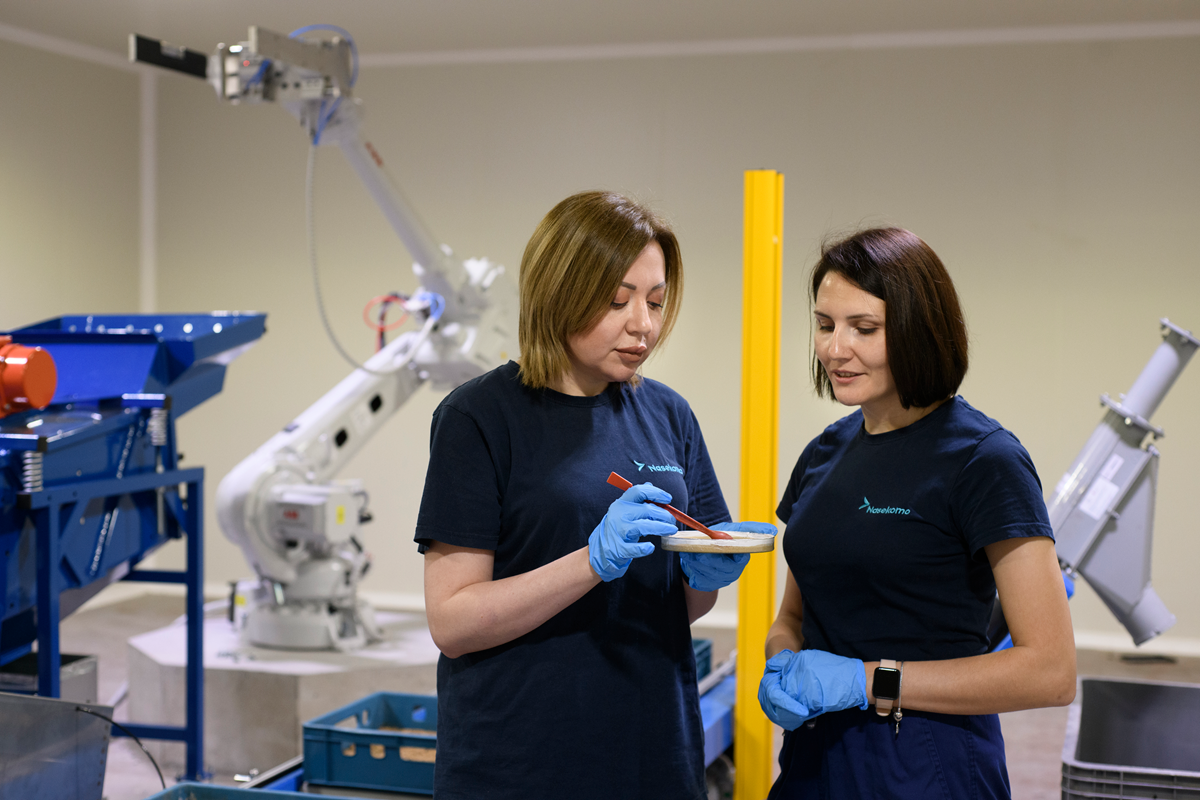 Nasekomo researchers working with biological material and industrial equipment